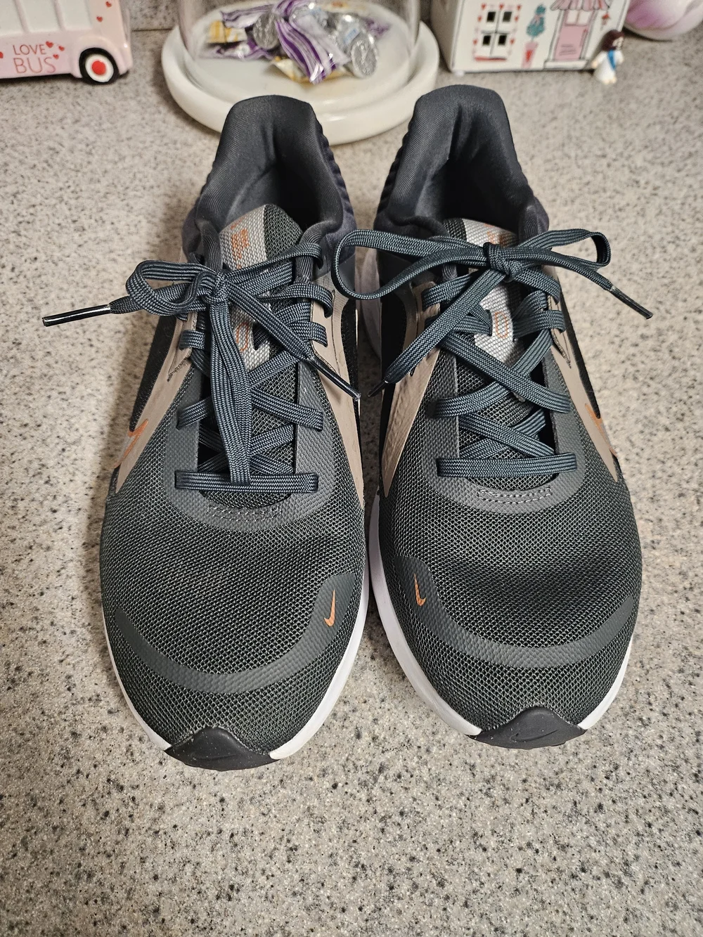 Nike Women's Black Running Shoes with Metallic Orange Swoosh